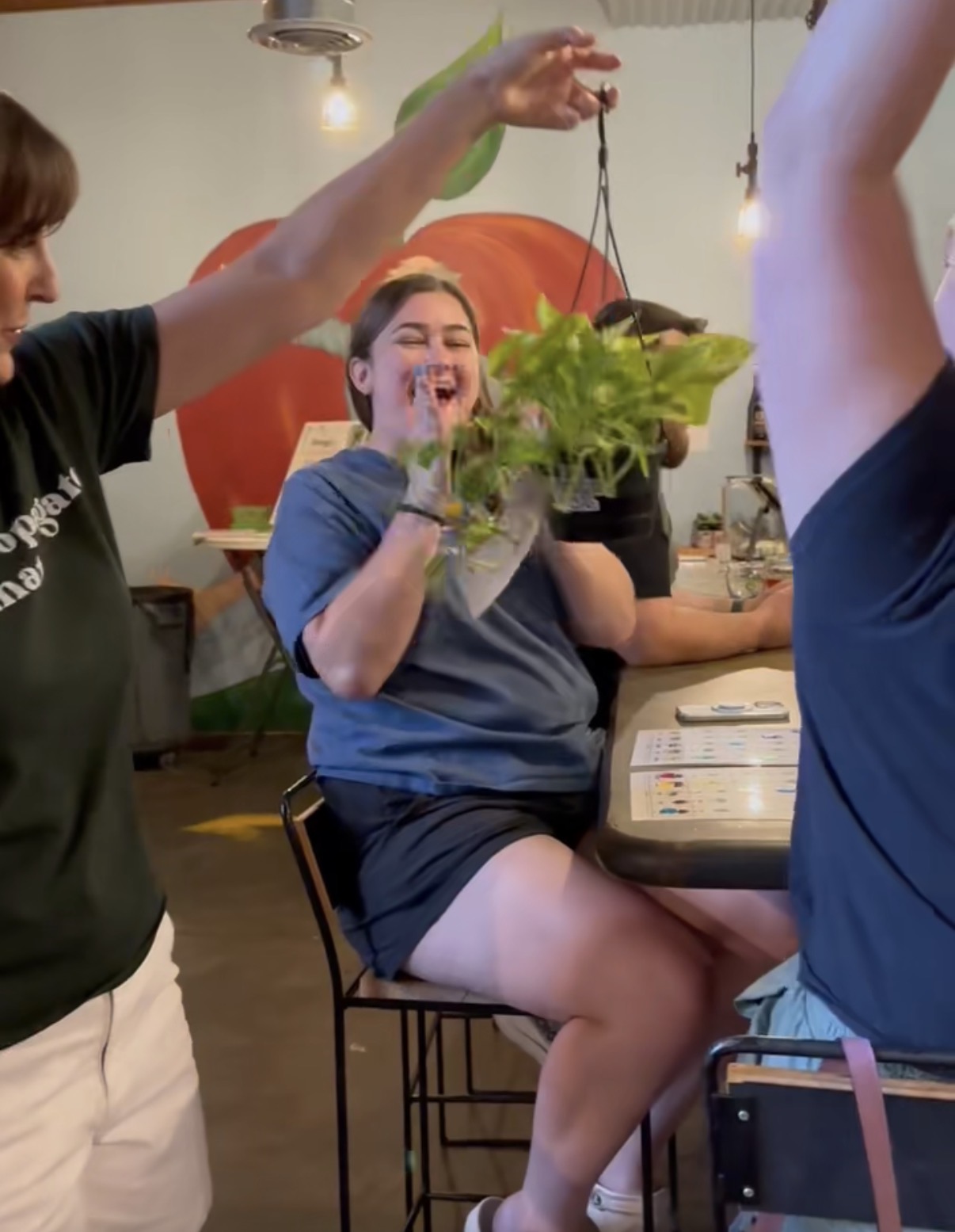 A good laugh and a hanging plant overhead